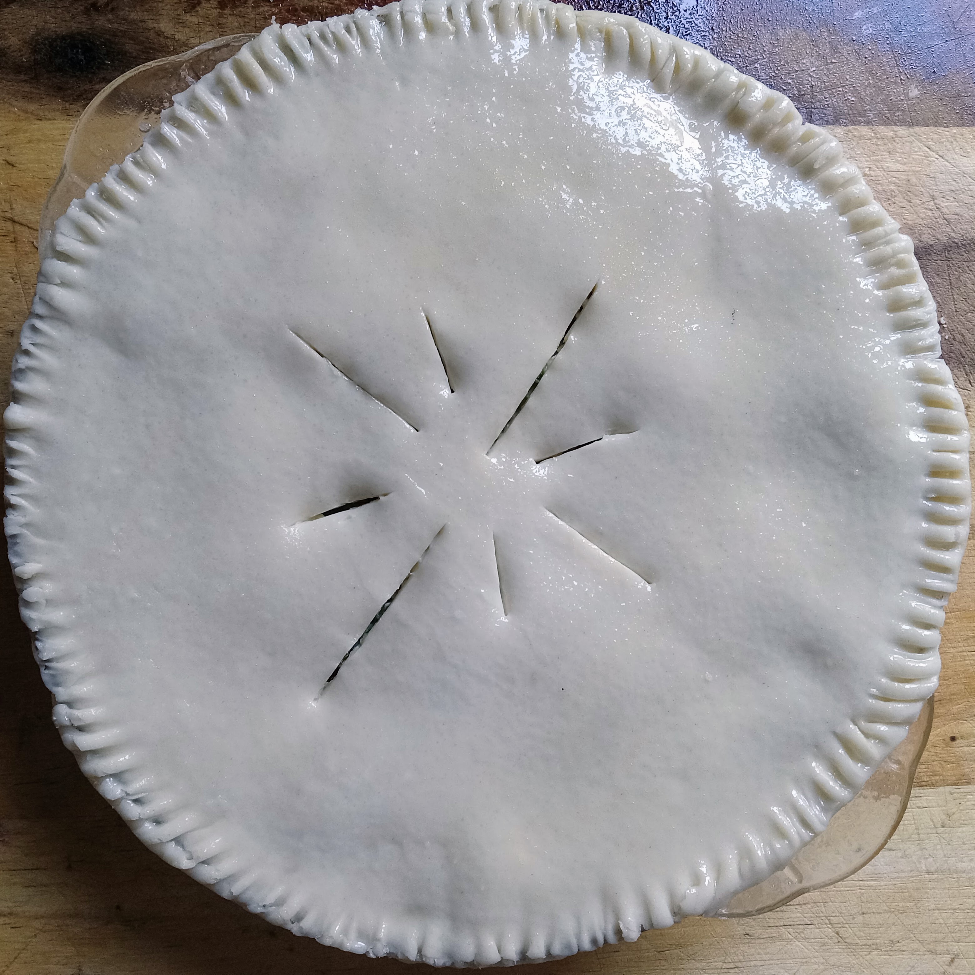 Pie crust with slits cut in the center